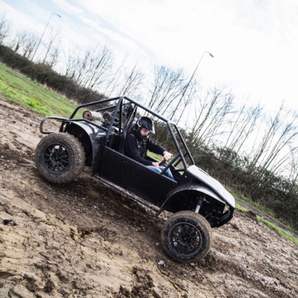 A person sliding through mud in a Rage Buggy for a Designa Jam Packed activity day