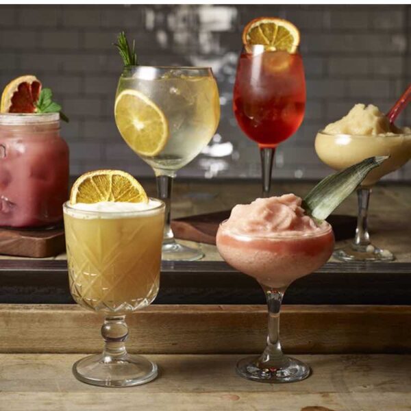 A close up of 6 different Cocktails in Revolution