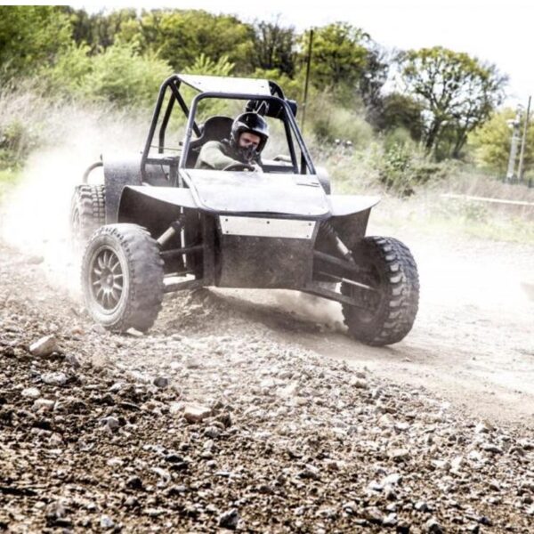 A man sliding through the dirt in a Rage Buggy on a Jam Packed activity package