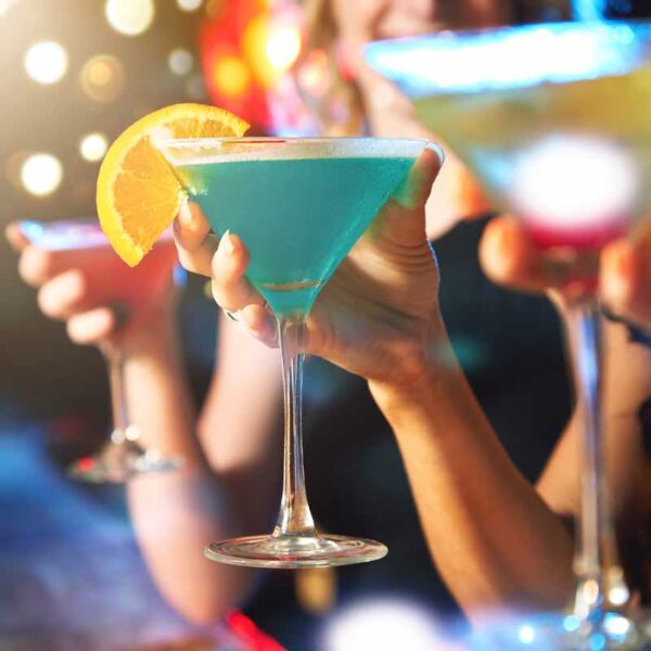 A close up of Cocktails being held