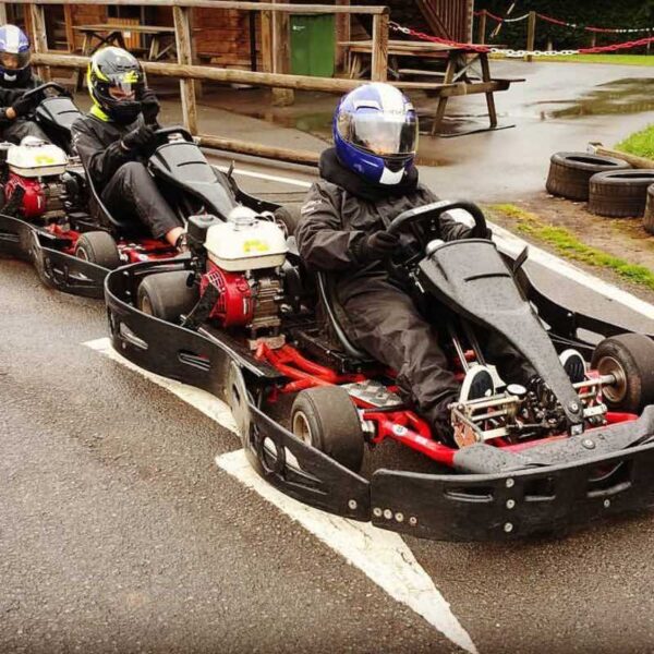 Three men lined up in Outdoor Race Karts