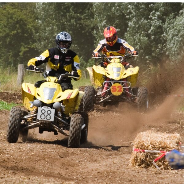 Two people Quad Bike Trekking in helmets and jumpsuits