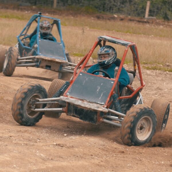 2 Rage Buggies racing around a dirt track in Bournemouth going head to head