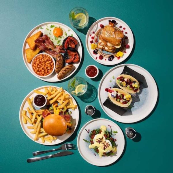 Birds eye view of various Slug & Lettuce Pub Meal Dishes with drinks
