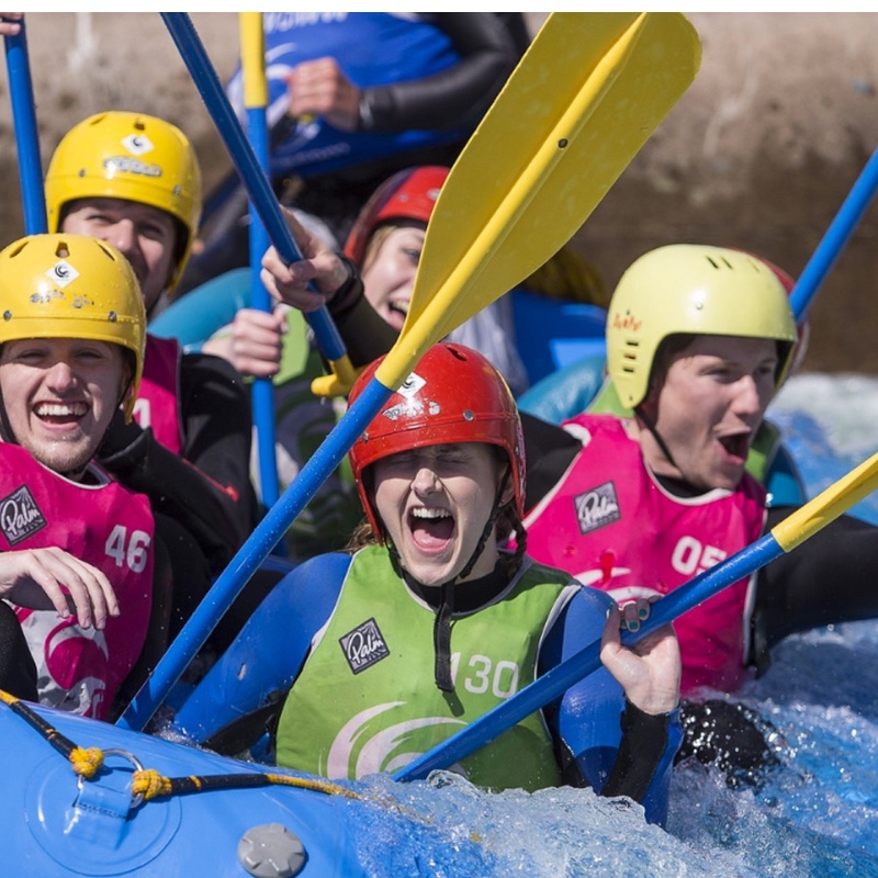 A close up image of a group laughing during White Water Rafting