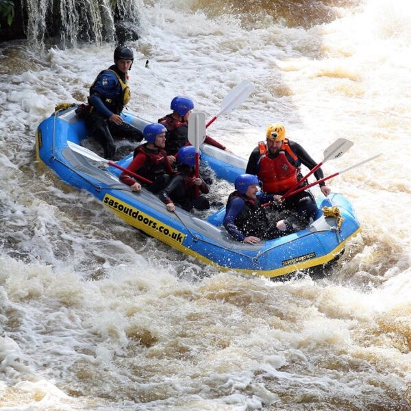 A group White Water Rafting down rapids