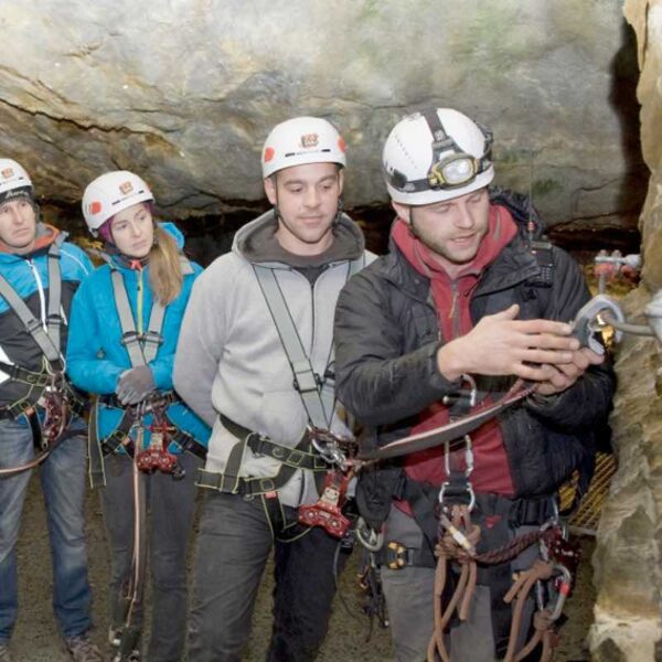 An instructor explaining to the group in the Zip Wire Caverns