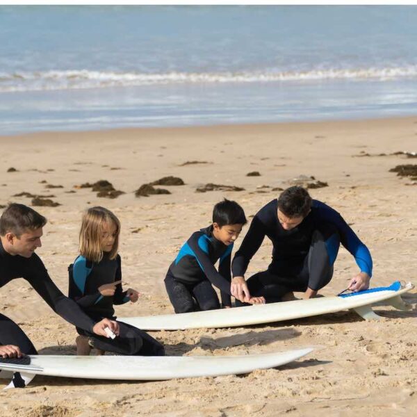 Family learning to surf