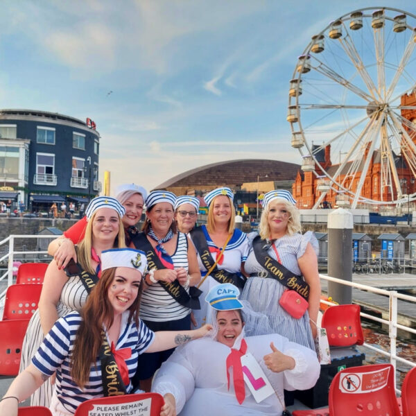 Group enjoying a party boat cruise in Cardiff